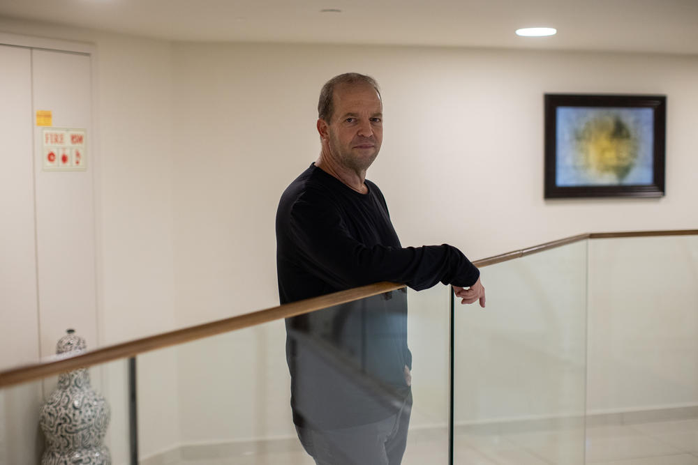 Erez Bergman, who was evacuated from Snir, his kibbutz in northern Israel located a few kilometers from the border with Lebanon, stands for a portrait at the Ramada Hotel where he is living temporarily on Nov. 28.