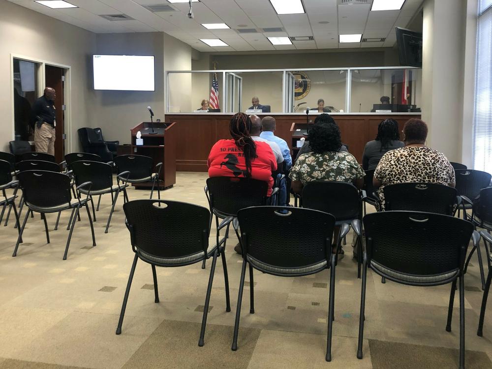 Family members of prisoners await to testify at a November meeting of the Alabama Board of Pardons and Paroles. The 3-member panel voted to deny every parole request before it during the hearing.