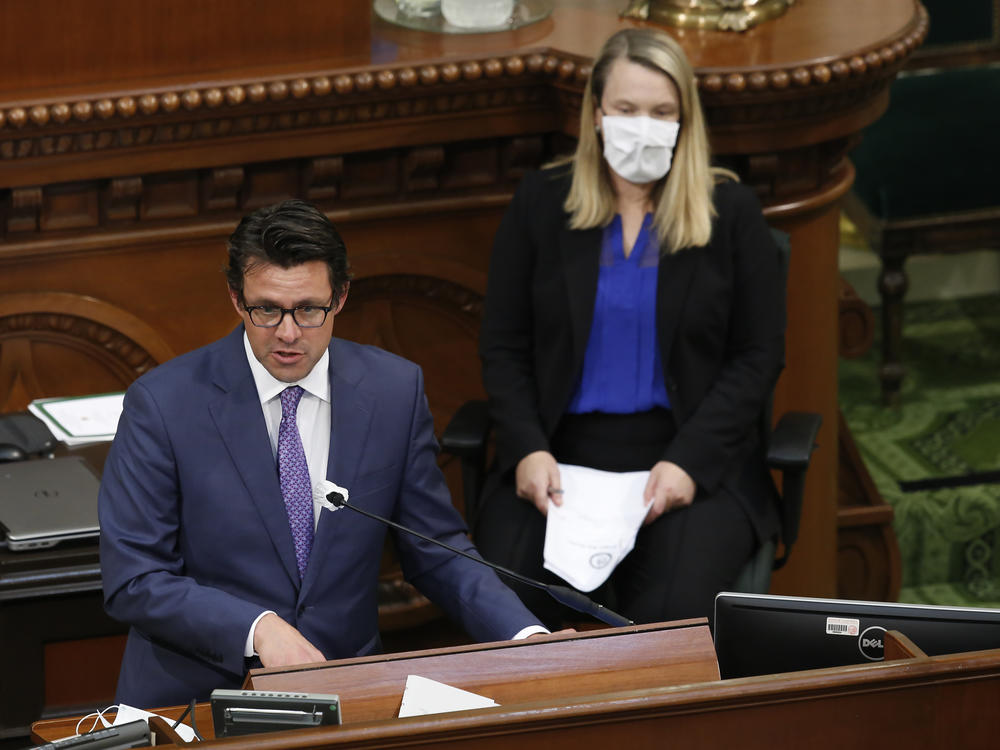 Legislative Analyst Gabriel Petek, left, discusses Gov. Gavin Newsom's proposed 2020-21 revised state budget during a hearing the state Capitol in Sacramento, Calif., May 26, 2020. On Thursday, Dec. 7, 2023, Petek said California is facing a $68 billion budget deficit.