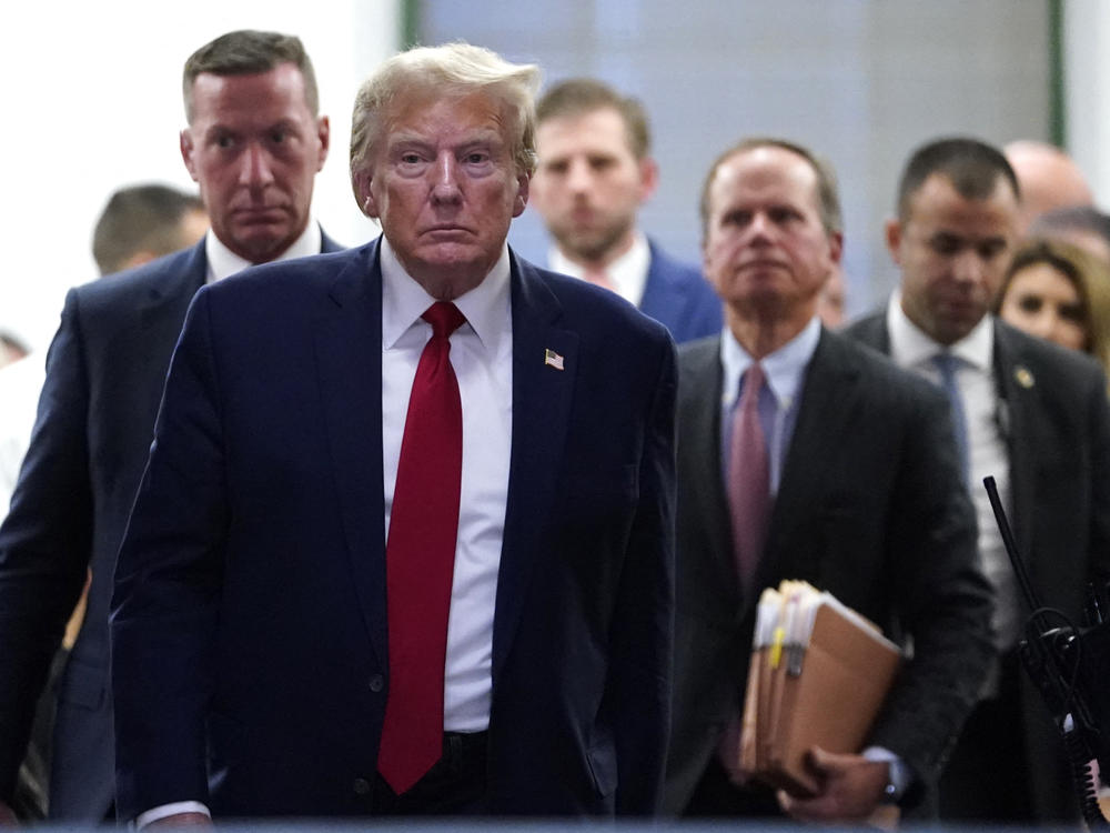 Former President Donald Trump departs for a break during his civil fraud trial in New York City on Thursday.