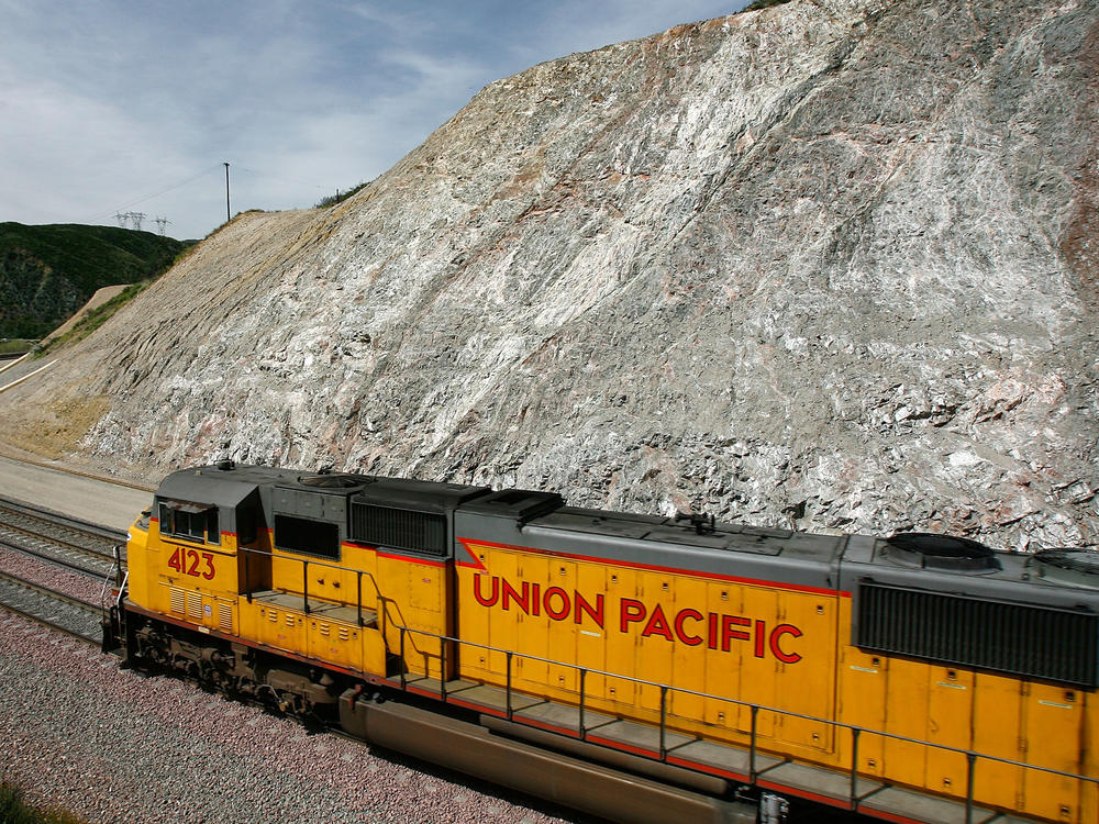 A freight train passes west of San Bernardino, California. In April, a Union Pacific railcar carrying 30 tons of explosive chemicals was found empty after a two week trip.