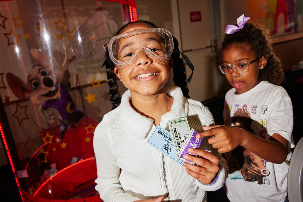 Zoe Shelley and Nah'la Fowler show off the tickets they grabbed in the 