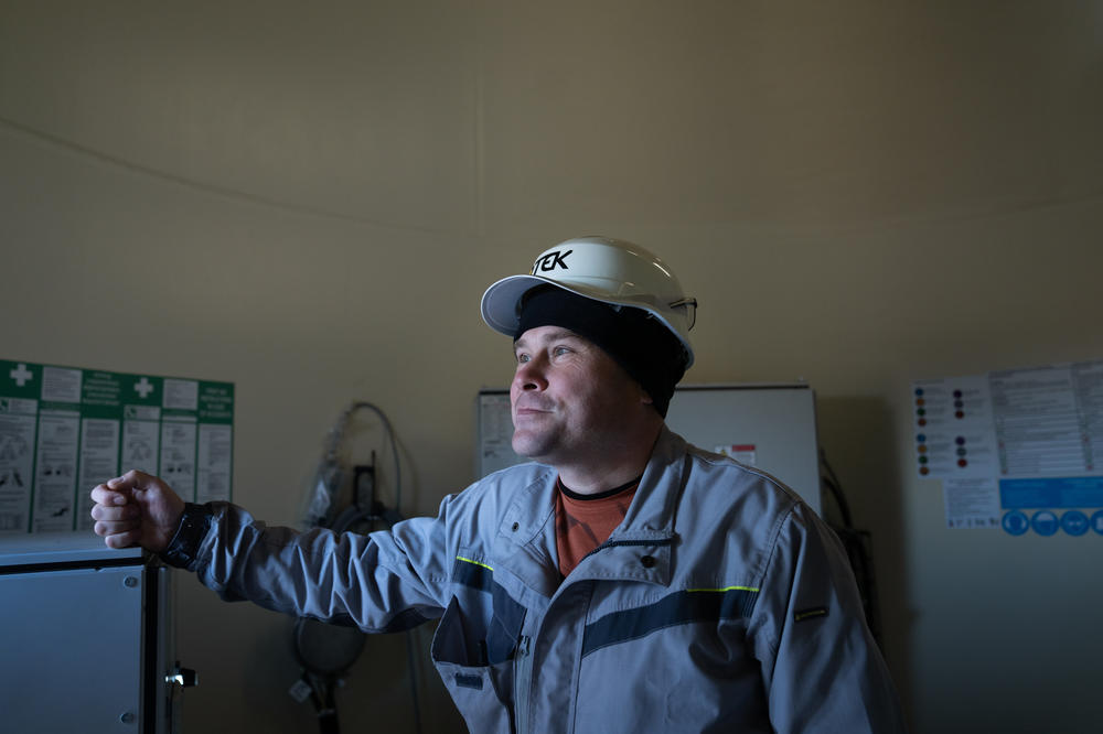 Maksym Bogadytsya, the chief power engineer at the Tylihulska Wind Power Station, stands inside one of the wind turbines in the Mykolaiv region.
