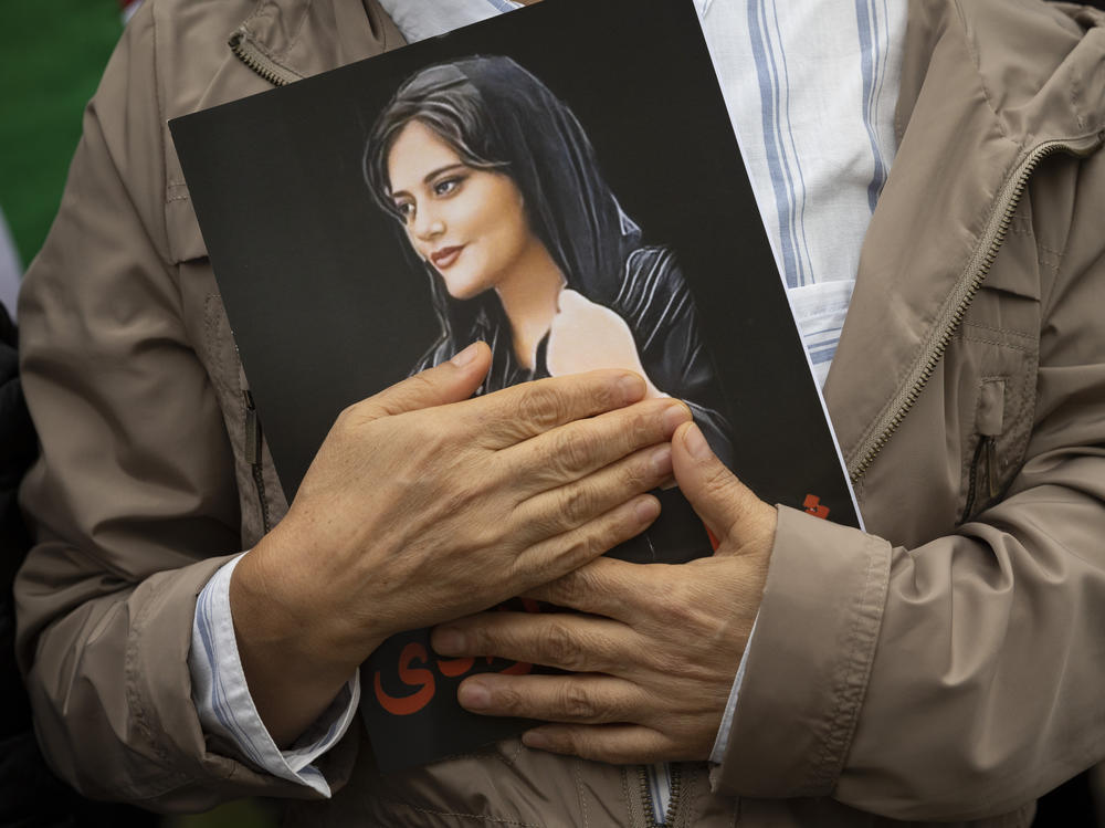 A portrait of Mahsa Amini is held during a rally in Washington, on Oct. 1, 2022. Amini, who also went by her Kurdish name, Jina, died in police custody in Iran last year, sparking worldwide protests against the country's conservative Islamic theocracy. She was awarded the European Union's top human rights prize on Thursday, Oct. 19, 2023.