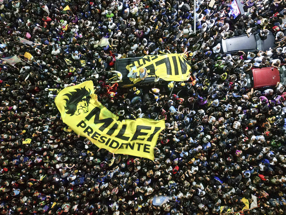 Supporters of presidential candidate Javier Milei gather outside his campaign headquarters, in Buenos Aires, Argentina, Nov. 19, 2023.
