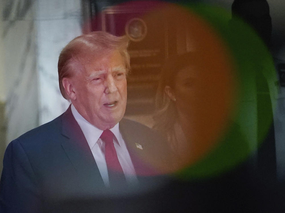 Former President Donald Trump speaks after exiting the courtroom for a break at New York Supreme Court on Dec. 7 in New York.