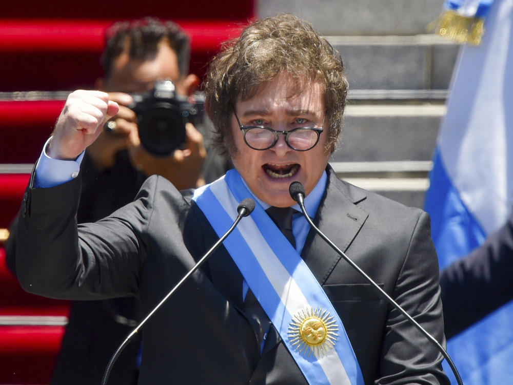 Argentina's newly sworn-in President Javier Milei speaks outside the Congress in Buenos Aires, Argentina, Sunday, Dec. 10, 2023.