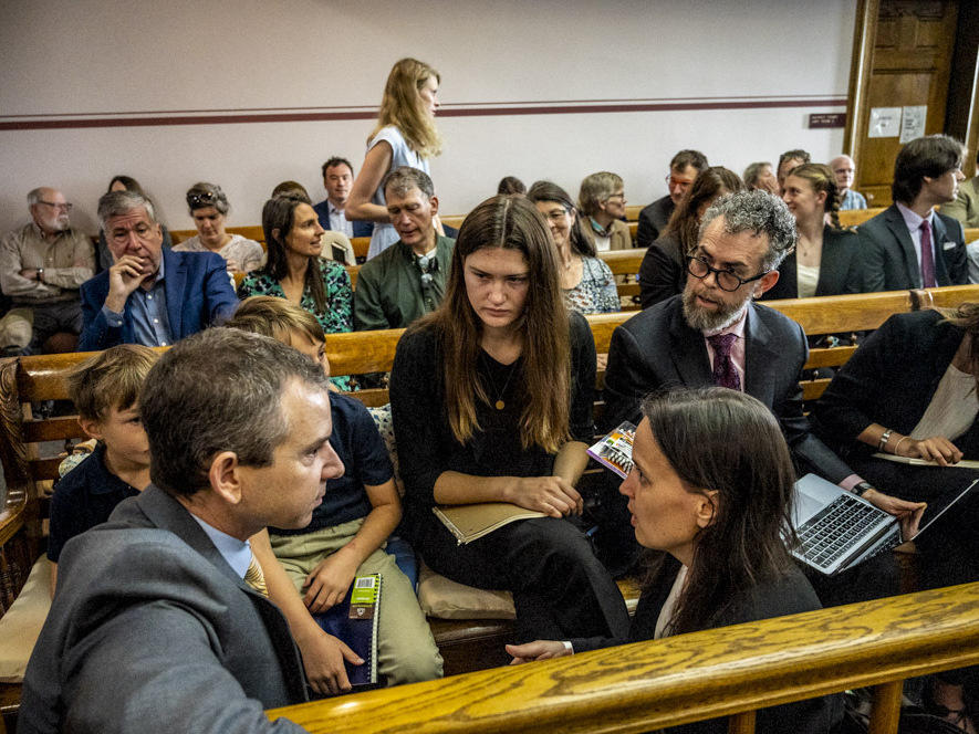 Lead claimant Rikki Held, 22, confers with members of Our Children's Trust legal team before the start of the nation's first youth climate change trial at Montana's First Judicial District Court on June 12, 2023 in Helena, Montana.