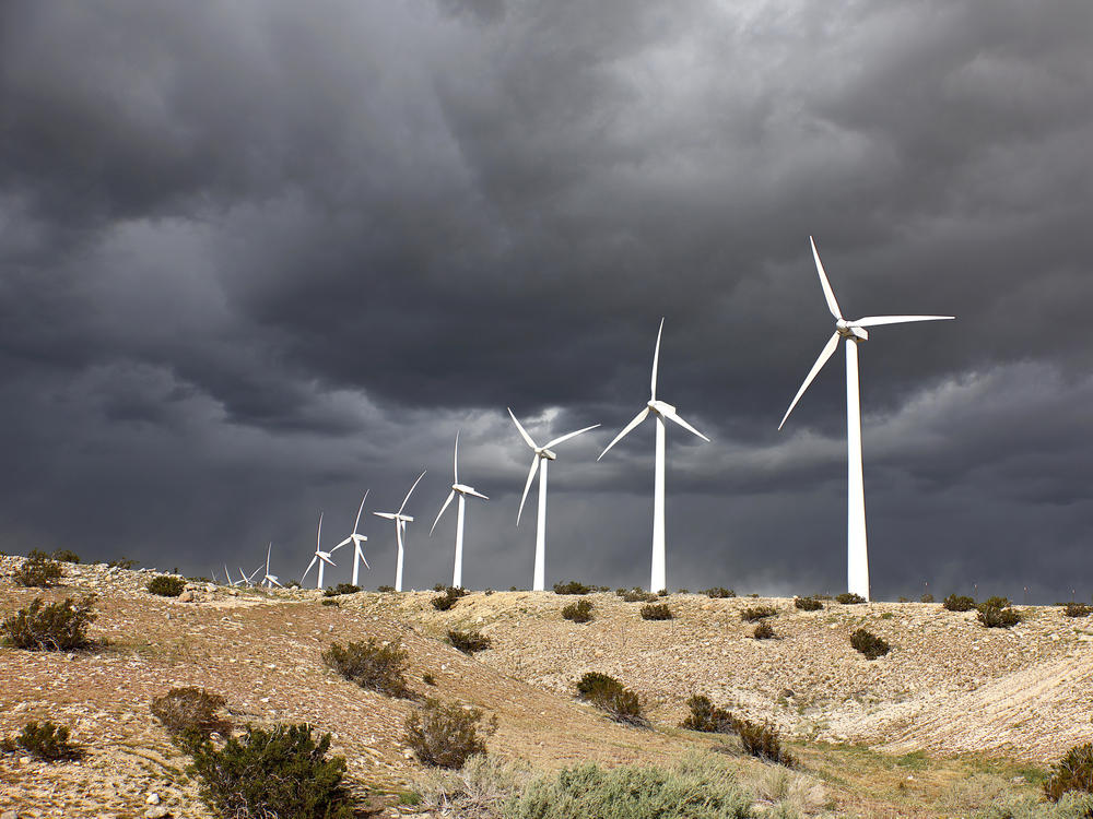 Wind turbines operate at a wind farm near Whitewater, Calif., on Feb. 22. Renewables tend to be lower risk than oil projects, but they also tend to deliver lower returns.