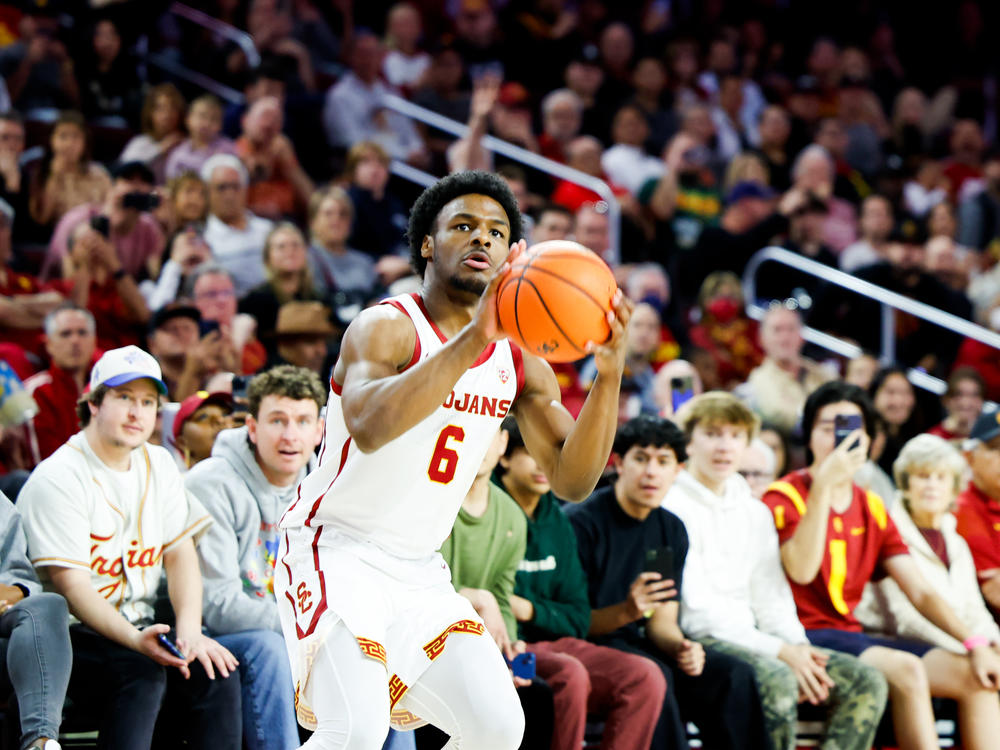 Bronny James shoots the ball during his debut on the court playing for University of Southern California on Sunday.