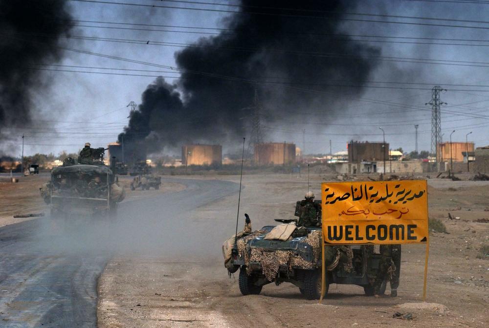 U.S. Marines from the 2nd Battalion 8th Regiment enter in the southern Iraqi city of Nasiriyah, where allied troops found stubborn resistance in their northbound advance toward the Iraqi capital Baghdad, on March 23, 2003.