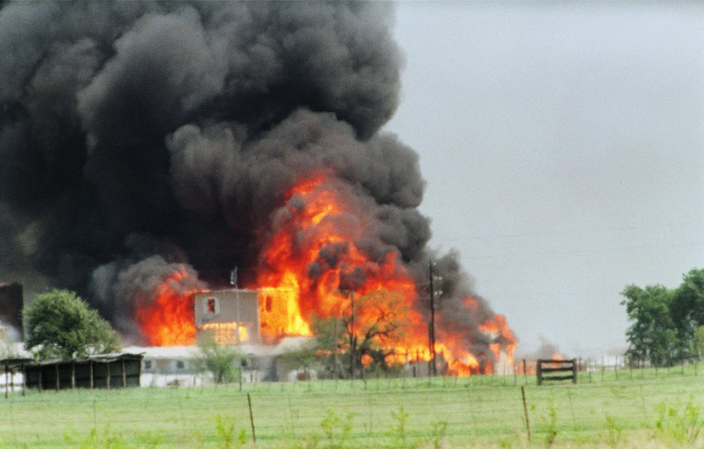 The Branch Davidian cult compound observation tower near Waco, Texas, is engulfed in flames on April 19, 1993. The siege began in February.