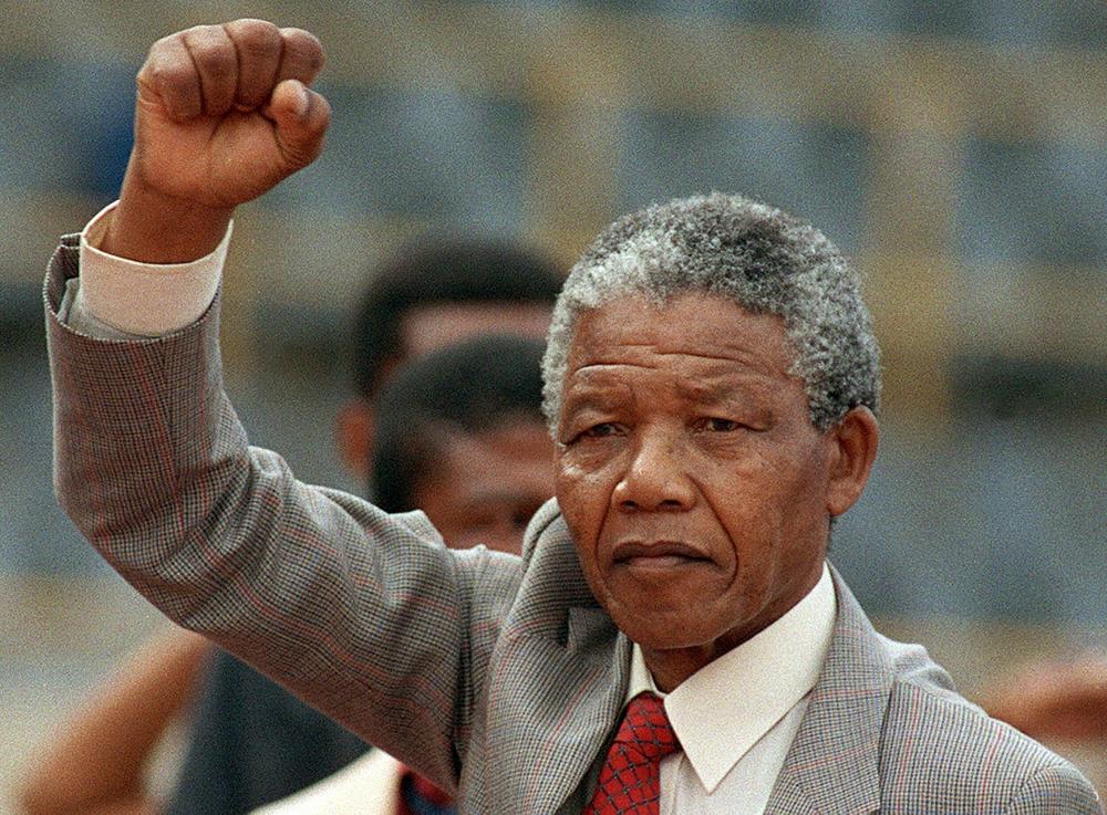 Anti-apartheid leader Nelson Mandela arrives to address a mass rally a few days after his release from prison on Feb. 25, 1990, in the town of Bloemfontein. In 2023, people around the world marked a decade since his death.