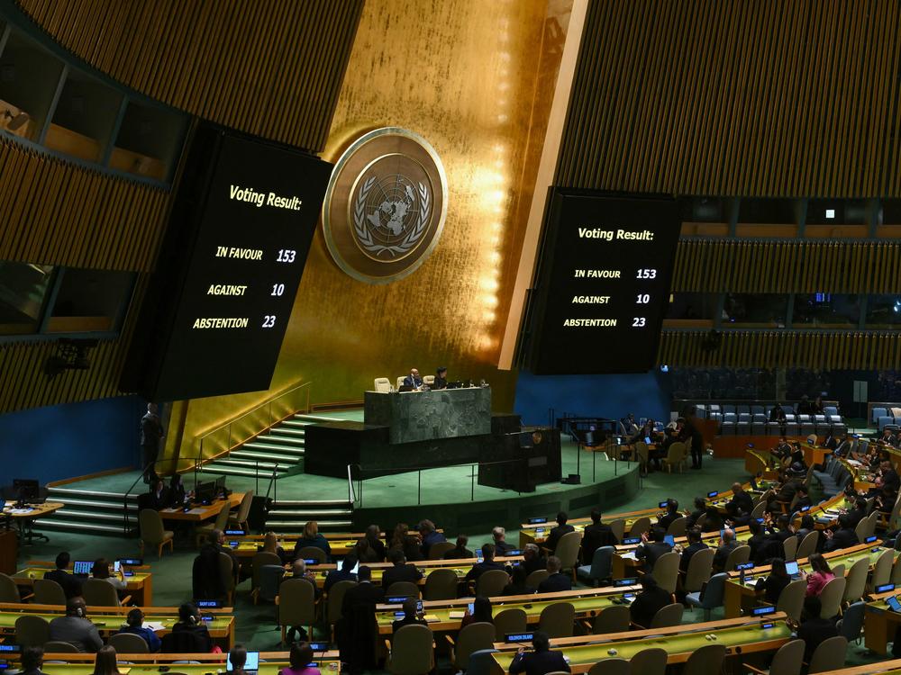 A general view shows voting results during a United Nations General Assembly meeting to vote on a non-binding resolution demanding 