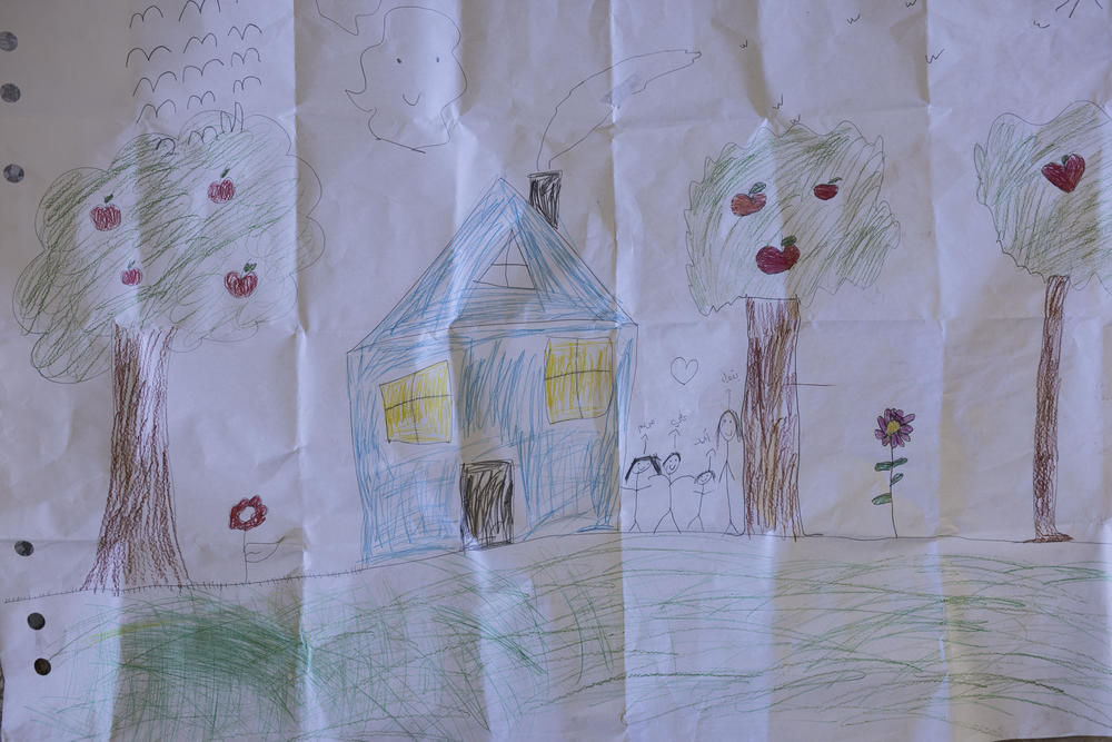 A drawing by children displaced by Israel-Lebanon border fighting hangs in a school used as a shelter.