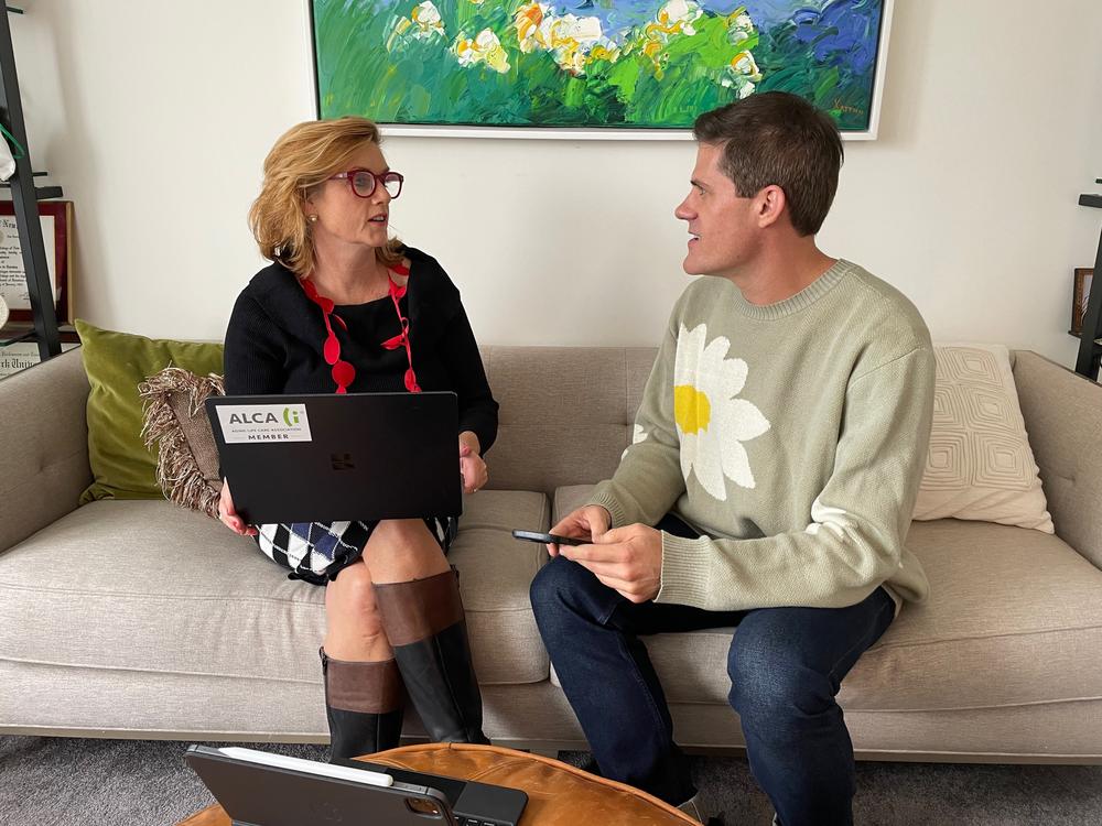 Anne Sansevero discusses a client with one of her nurses, Beau Romero. Sansevero has seven employees in her growing private care management business in New York City.