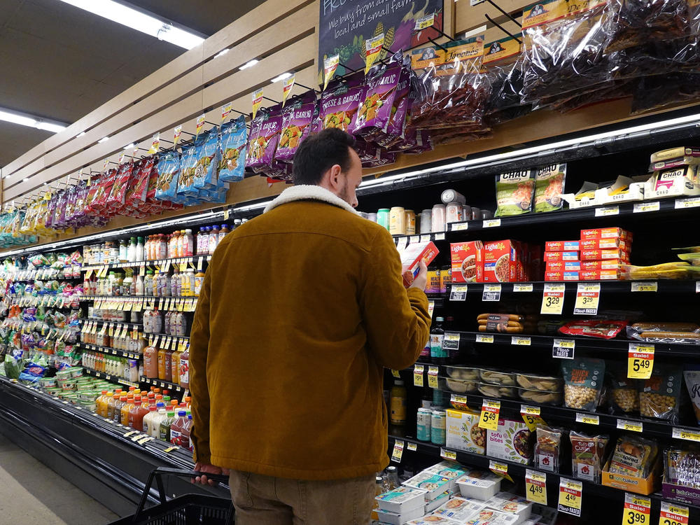 Customers shop for groceries in Chicago on Nov. 20, 2023. Annual inflation eased to 3.1% last month, helped in part by slower gains in gas and grocery prices.