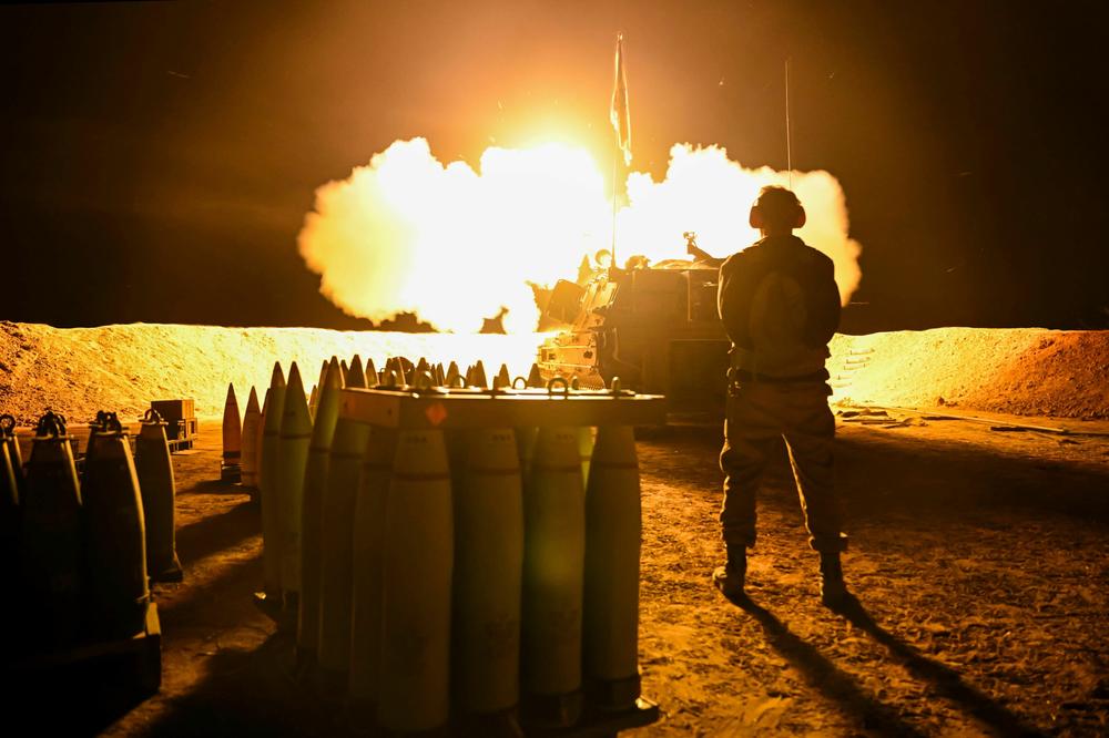 An Israel Defense Forces artillery unit fires towards Gaza near the border on December 11, 2023 in Southern Israel. Israel's AI system can be used to send targets to forces on land, air and sea.