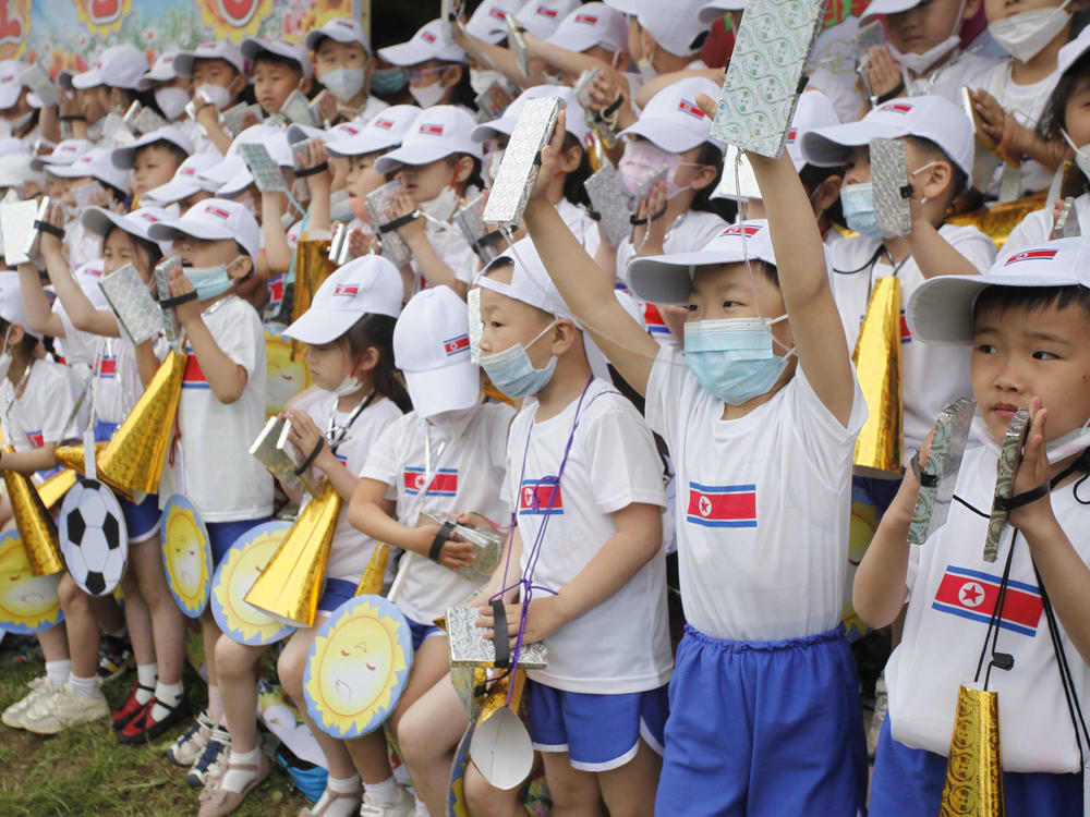 Children cheer during an event marking the 73rd anniversary of the International Children's Day at the Taesongsan Amusement Park in Pyongyang, North Korea on June 1, 2023.
