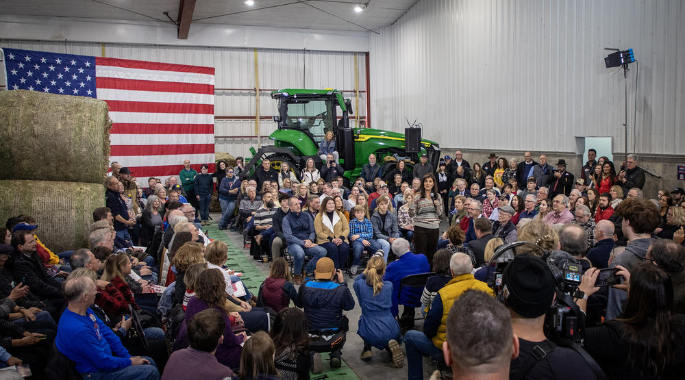 Republican presidential candidate Nikki Haley talks with voters in Waukee, Iowa on Dec. 10.