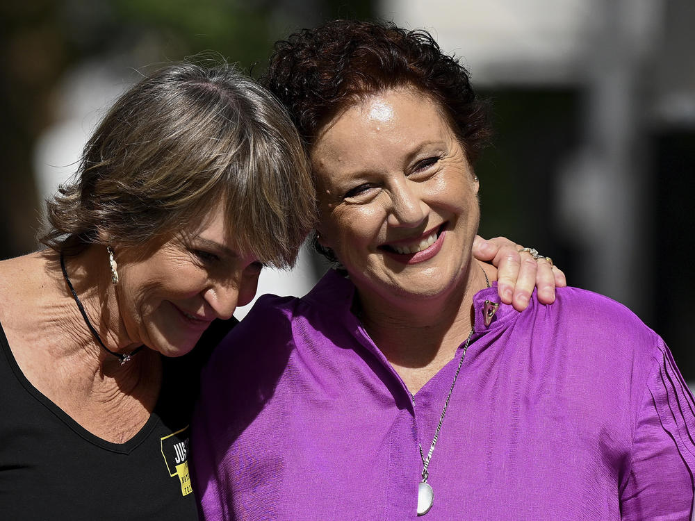 Kathleen Folbigg, right, is embraced by friend Tracy Chapman outside the New South Wales Court of Criminal Appeal in Sydney, Australia, Thursday, Dec. 14, 2023.