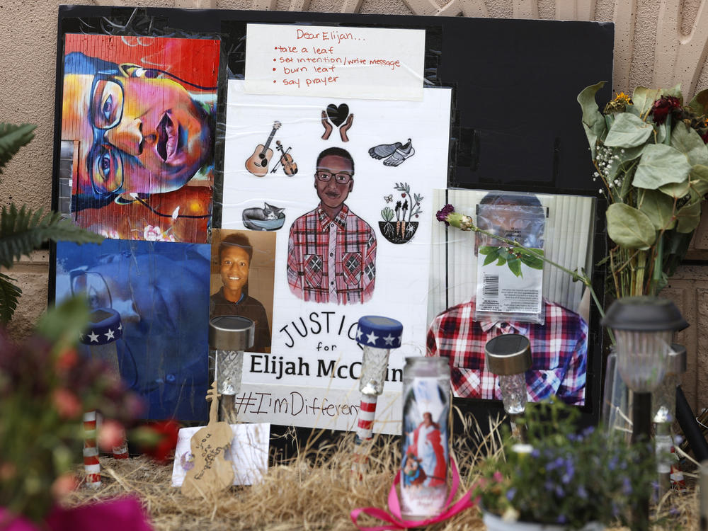 In this July 3, 2020, file photo, a makeshift memorial stands at a site across the street from where Elijah McClain was stopped by police officers while walking home in Aurora, Colo.