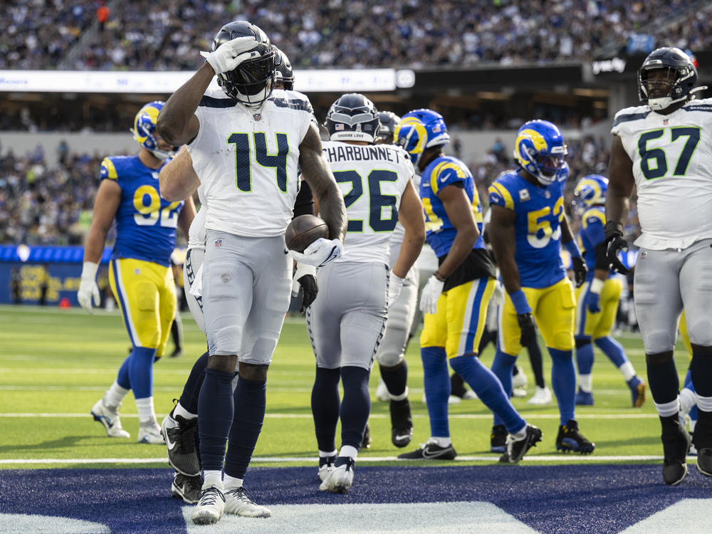 Seattle Seahawks wide receiver DK Metcalf (14) celebrates his touchdown by using American Sign Language during an NFL football game against the Los Angeles Rams, Sunday, Nov. 19, 2023, in Inglewood, Calif.