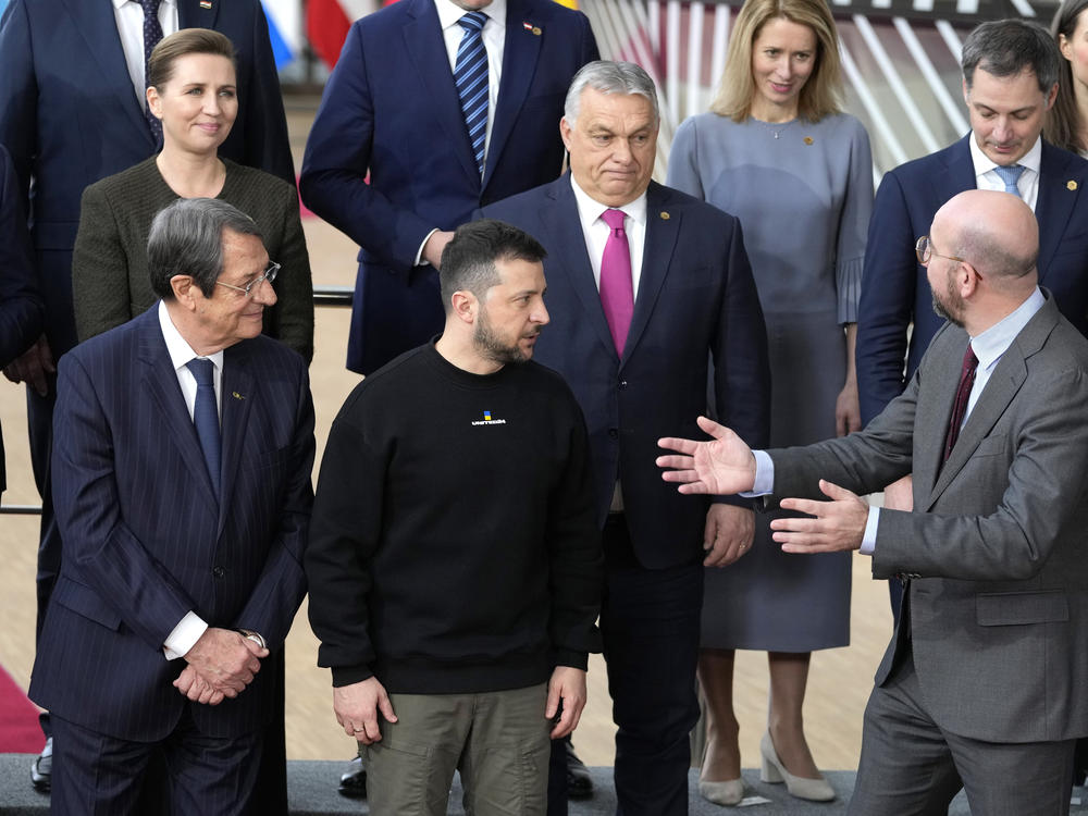 European Council President Charles Michel, front right, speaks with Ukraine's President Volodymyr Zelenskyy, front second right, and Hungary's Prime Minister Viktor Orban, second row center, as they pose with other European Union leaders for a group photo at an EU summit in Brussels on Thursday, Feb. 9, 2023.