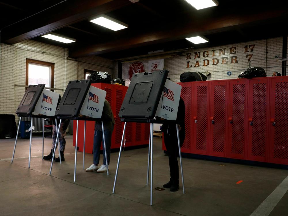 Voters cast their ballots during the midterm elections at the Detroit Fire Station 17 on Nov. 8, 2022.