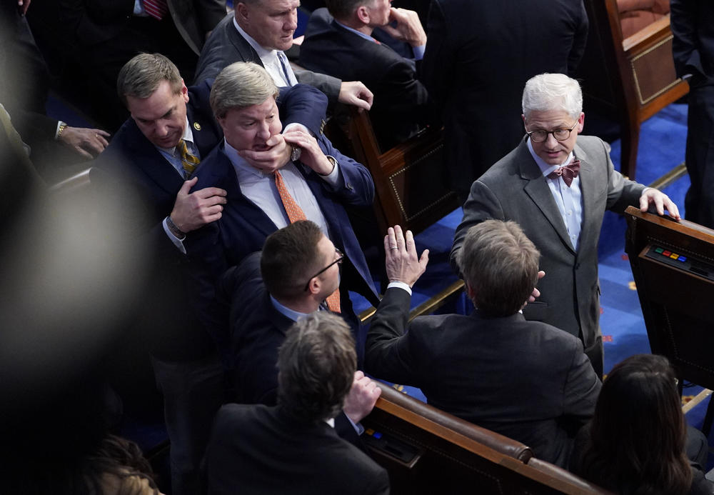 Rep. Mike Rogers, R-Ala., is restrained after getting into an argument with Rep. Matt Gaetz, R-Fla., during in the 14th round of voting for speaker on Jan. 6 at the Capitol.