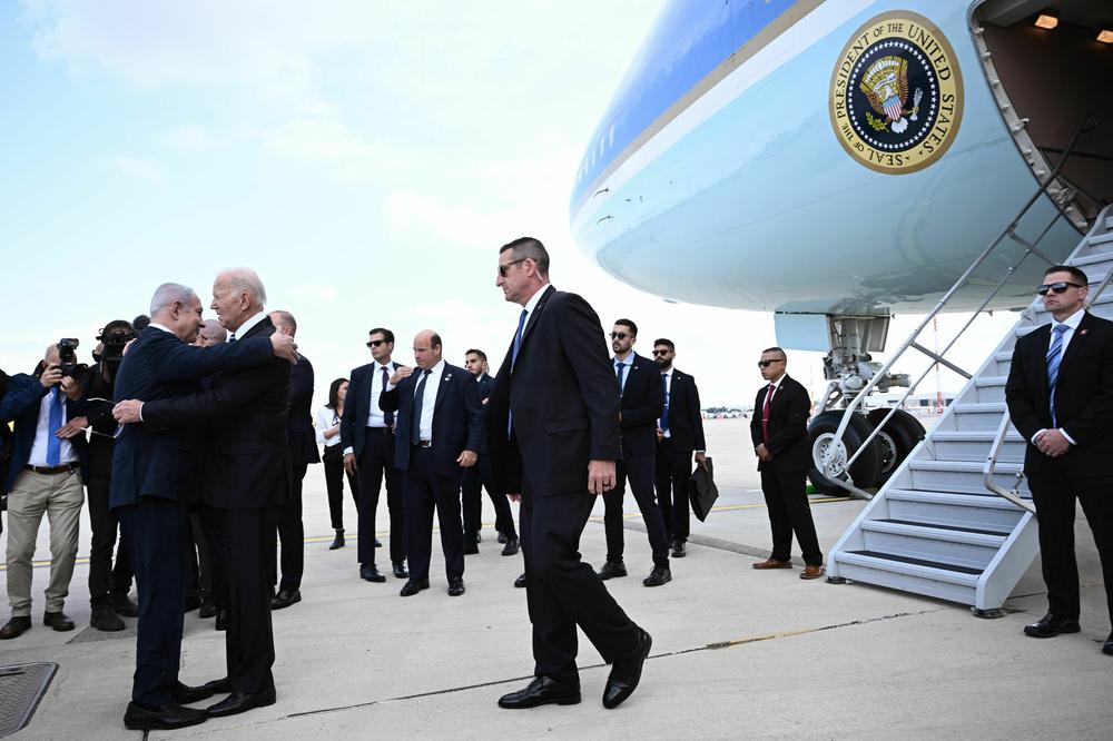 Israel Prime Minister Benjamin Netanyahu hugs President Biden upon his arrival at Tel Aviv's Ben Gurion airport on Oct. 18, amid the ongoing battles between Israel and Hamas.