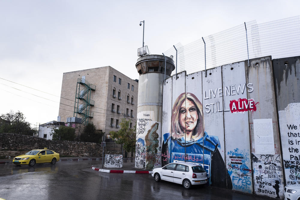 The West Bank barrier separates Bethlehem from encroaching Israeli settlements. It has been adorned with graffiti, including a memorial for the journalist Shireen Abu Akleh, who was killed by what U.S. officials say was likely Israeli gunfire.