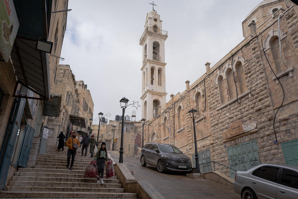 The ancient cobble stone streets radiating from Manger Square in Bethlehem to the old city would normally be filled with colored lights and bustling with foreign tourists. This year, they are mostly empty.