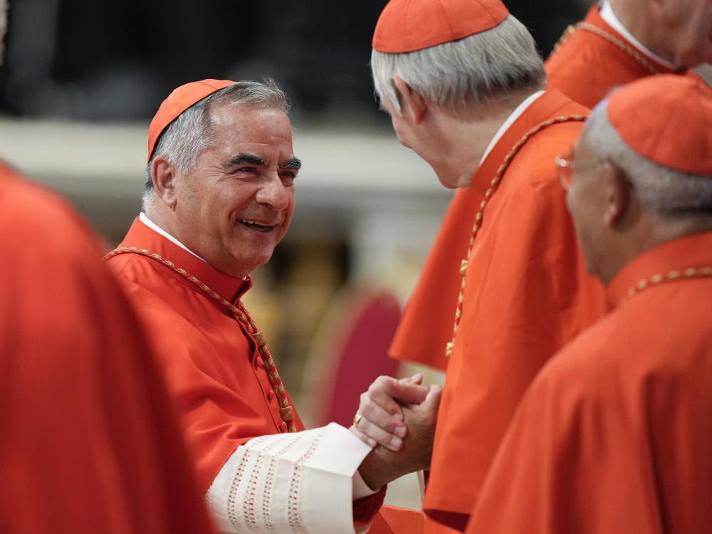Cardinal Angelo Becciu attends a consistory inside St. Peter's Basilica, at the Vatican, on Aug. 27, 2022.