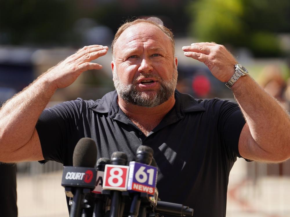 InfoWars founder Alex Jones speaks to the media outside Waterbury Superior Court during his trial on Sept. 21, 2022 in Waterbury, Conn.