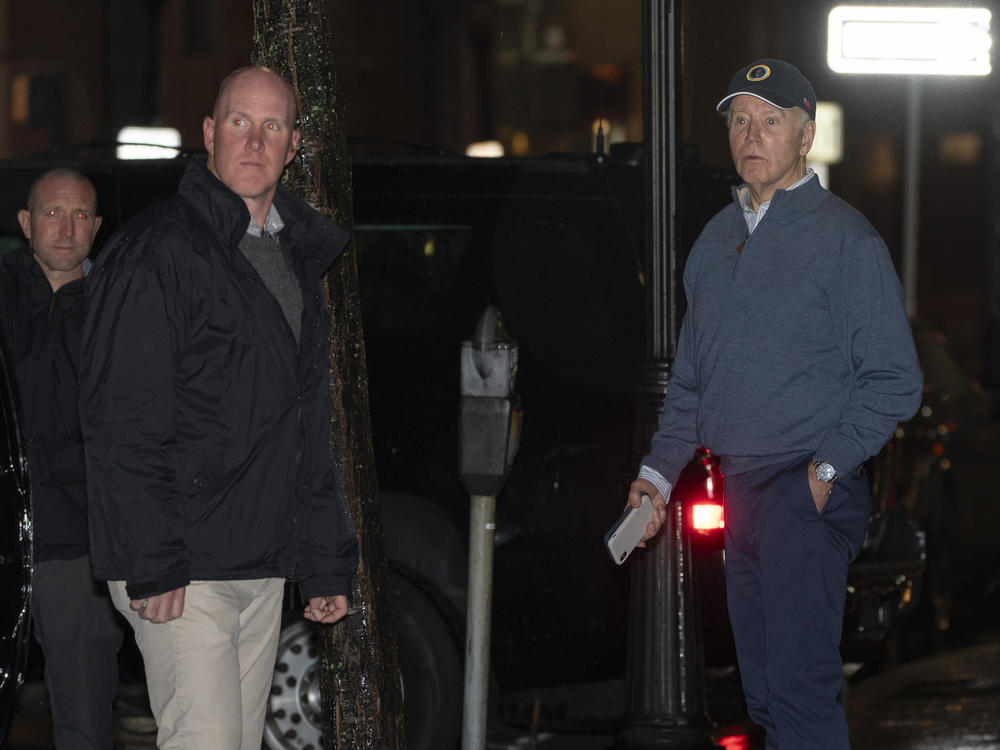 President Biden reacts after hearing a loud bang as he leaves his campaign headquarters in Wilmington, Del., on Sunday.