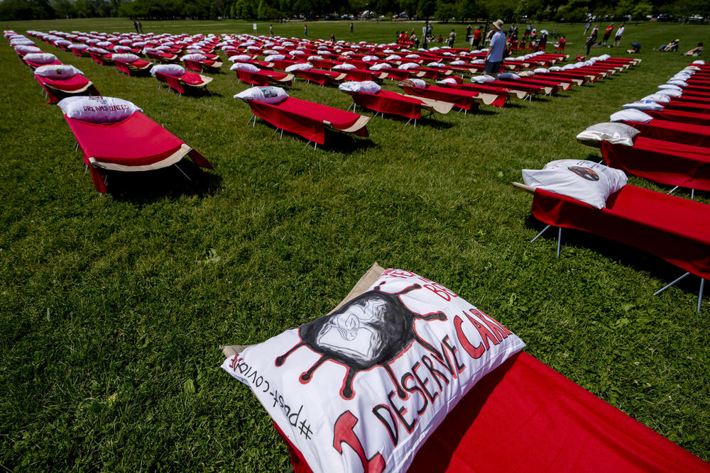 Patients and advocates for people suffering from long COVID and myalgic encephalomyelitis/chronic fatigue syndrome hosted an installation of 300 cots in front of the Washington Monument on the National Mall in Washington, D.C., in May, to represent the millions of people suffering from post-infectious disease.