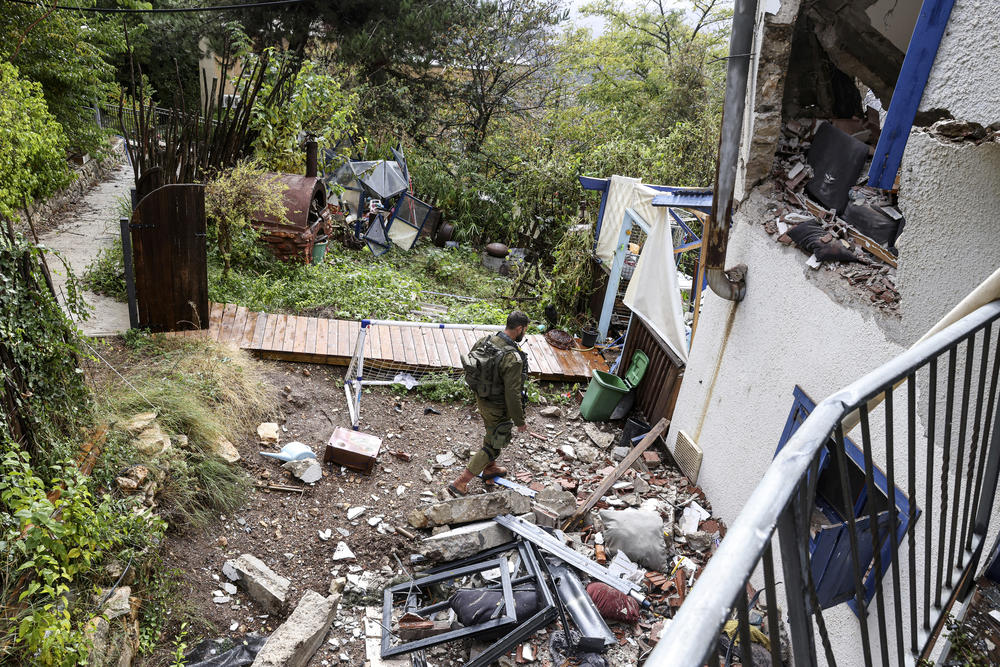 A soldier walks amid the rubble of a house damaged in a strike by Lebanon's Hezbollah movement in Kibbutz Manara in northern Israel near the Lebanon border, on Nov. 27.