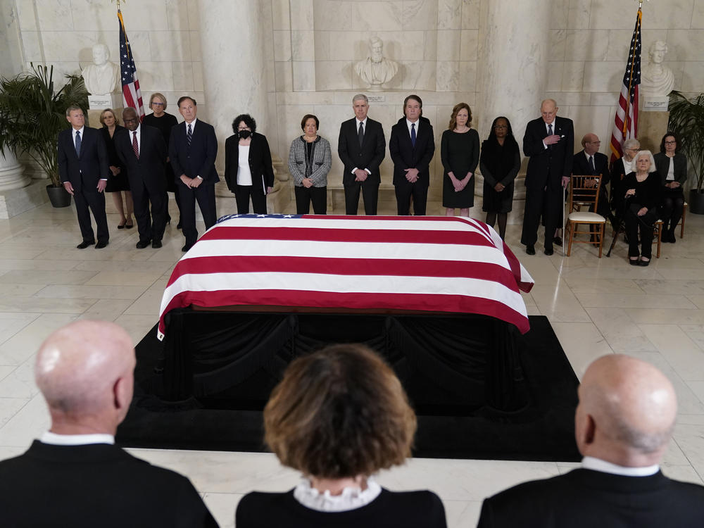 Siting Supreme Court justices, as well as retired Justice Anthony Kennedy and members of O'Connor's family, stand in front of her casket in the Great Hall on Monday.