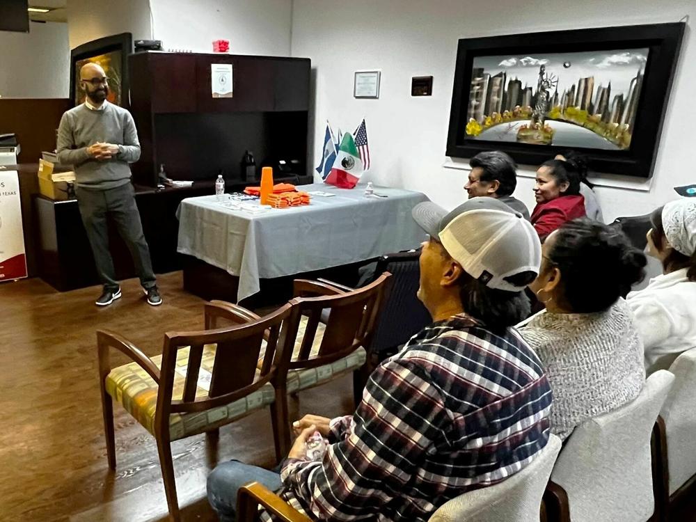 Haim Vasquez, an immigration attorney, talks to residents in Garland, Texas about new state border enforcement laws that will go into effect early next year. He says he wants immigrants to know their rights in case they get detained or arrested by law enforcement.