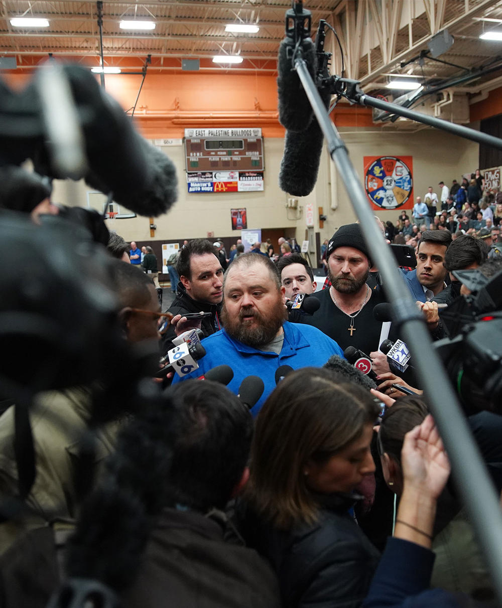 East Palestine Mayor Trent Conaway talks to reporters during a contentious community meeting on Feb. 15, 2023, about the fiery, toxic train derailment that occurred in the Ohio community earlier that month. Full story <a href=