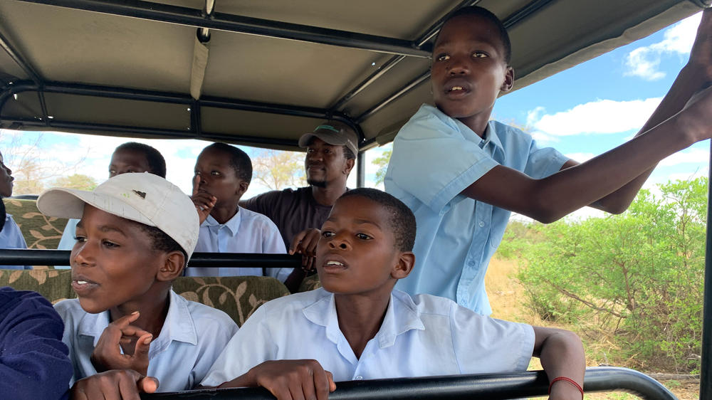 Fortune (standing) is often quiet and reserved. But on the safari drive in Botswana his shyness gives way to excitement as soon as he starts spotting the animals.