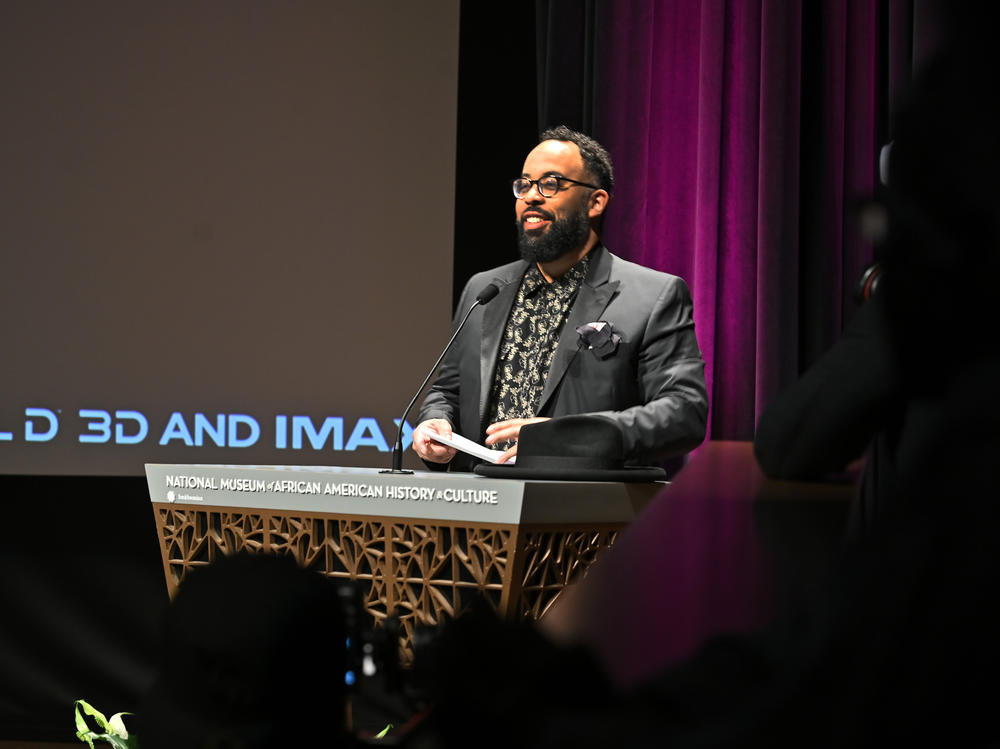 Kevin Young, director of the  National Museum of African American History and Culture, speaks at a screening of <em>Black Panther:Wakanda Forever</em> at the museum on Oct. 30, 2022.