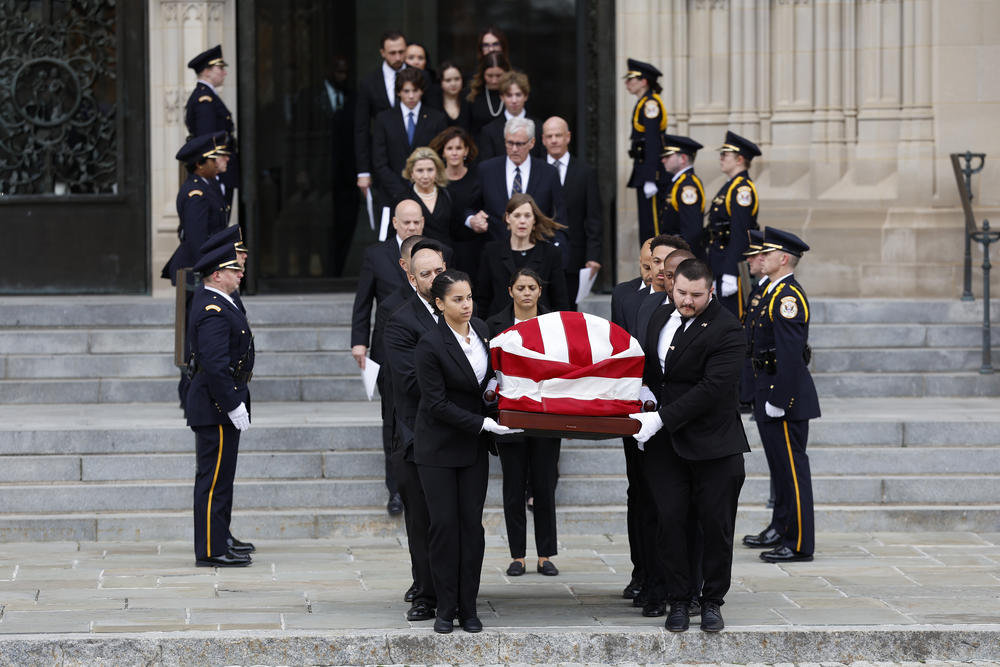 Pallbearers carry the casket for the late Supreme Court Justice Sandra Day O'Connor out of the Washington National Cathedral after her funeral service.