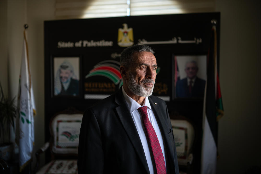 Dia M. Qurt, the mayor of Beitunia, stands for a portrait at his office, Dec. 2.