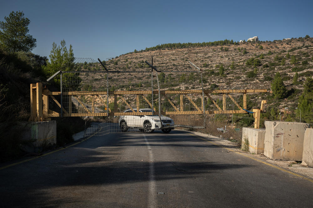 A gate on a Palestinian road near Deir Ibzi, which is normally open, is closed, preventing Palestinian drivers from reaching a road shared by Palestinians and Israelis in the occupied West Bank, on Dec. 2.