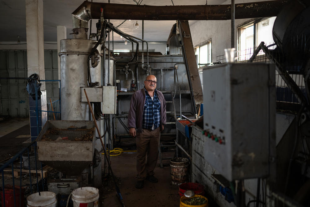 Saad Awwad at his olive pressing facility in the Palestinian village of Deir Ibzi in the occupied West Bank, Dec. 2.