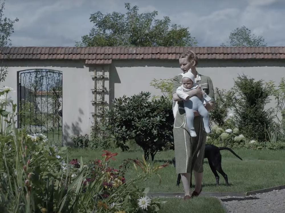 Sandra Hüller plays a mother who lives next door to Auschwitz in <em>The Zone of Interest.</em>