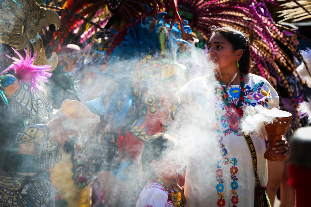 The Mitotiliztli Yaoyollohtli Aztec dance company lines up for a march for Santos Rodriguez, a 12-year-old shot by a Dallas police officer in 1973, during a 50th anniversary commemoration on July 23, 2023, in downtown Dallas. Full story <a href=
