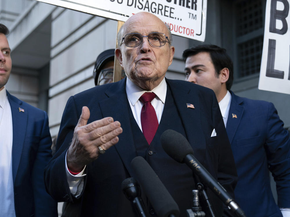 Rudy Giuliani speaks during a news conference after his defamation trial outside the federal courthouse in Washington, on Dec. 15. A jury awarded $148 million in damages to two former Georgia election workers who sued Giuliani for defamation over lies he spread about them in 2020 that upended their lives with racist threats and harassment. (A judge lowered the jury's award to $146 million.)